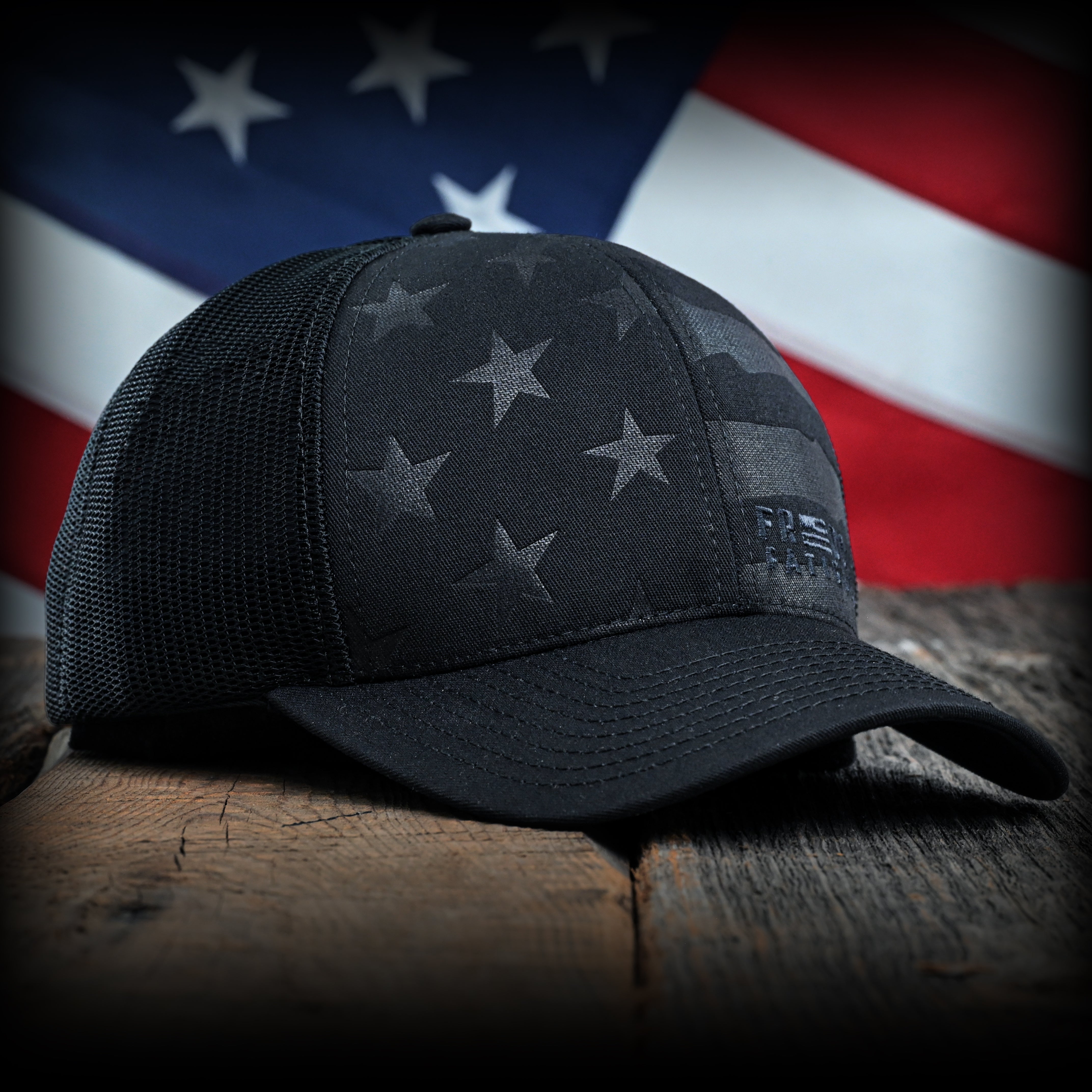 Blacked Out Debossed American Flag Trucker Hat