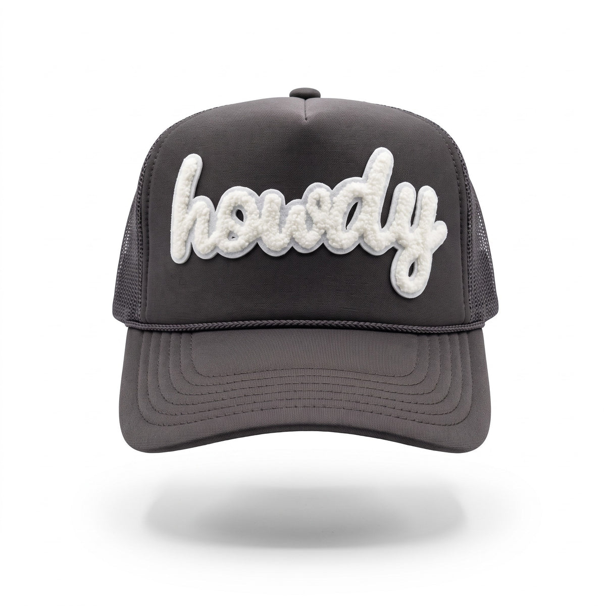 A dark gray trucker hat with a curved brim and mesh back, featuring the word 'howdy' embroidered in white cursive across the front panels.