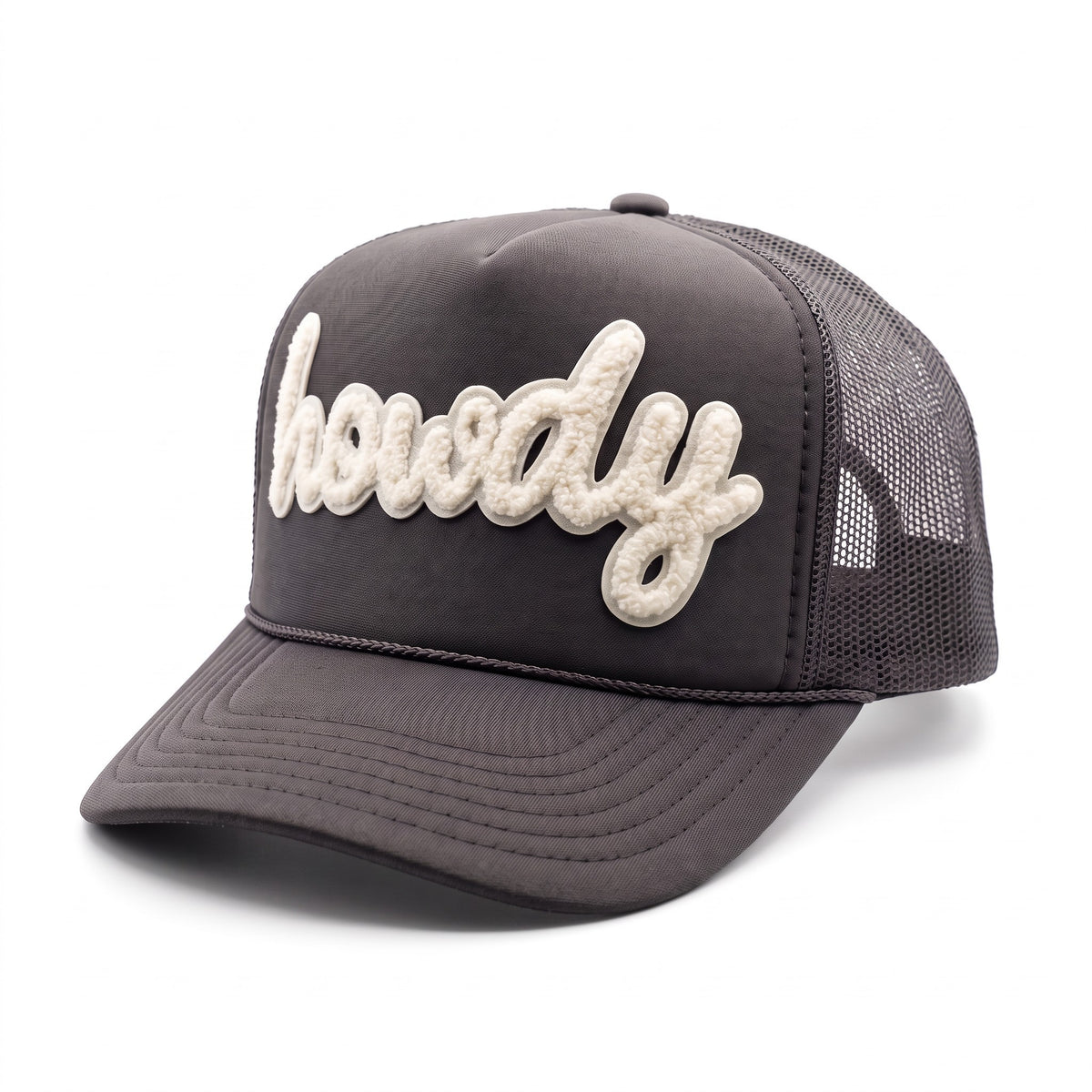 A dark gray trucker hat with a curved brim, featuring the word 'howdy' embroidered in raised, textured cream letters across the front panels, set against a plain white background.