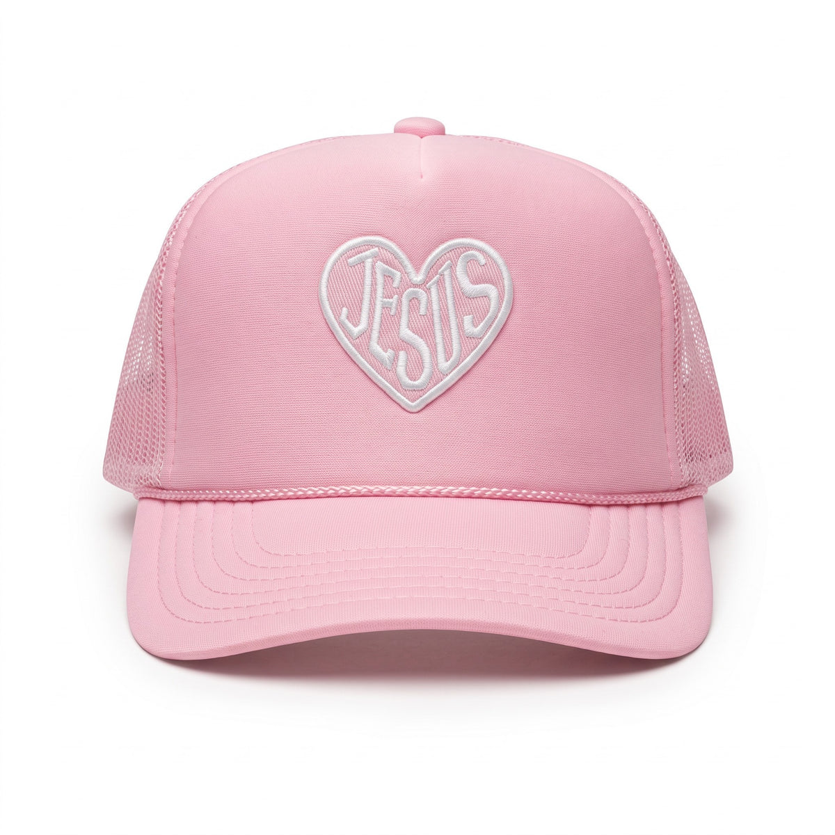 A pink trucker-style cap with a white embroidered heart outline on the front containing the word 'Jesus' in cursive, shown against a plain white background.
