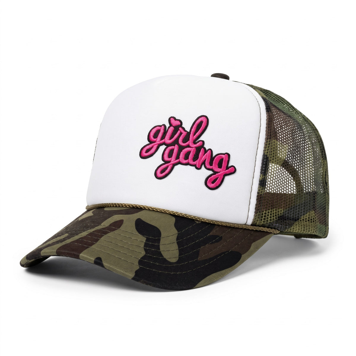 A trucker-style baseball cap with a white front panel featuring the words 'girl gang' in pink script with a black outline, and a camouflage pattern on the brim and mesh back.