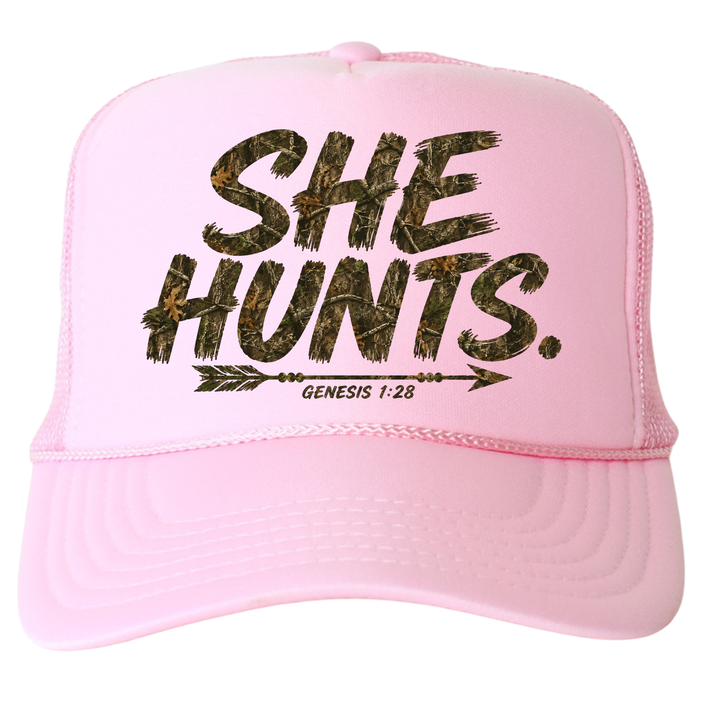A light pink trucker hat with a camouflage patterned graphic that reads 'SHE HUNTS.' and 'GENESIS 1:28' under an arrow, shown on a plain white background.